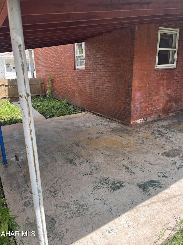 view of patio featuring fence