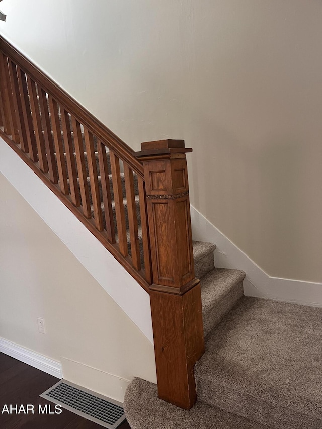 stairway with baseboards