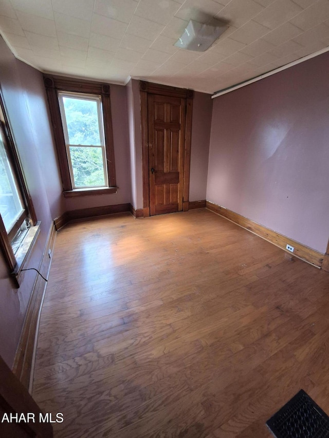 unfurnished room with light wood-type flooring