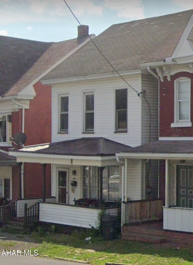 1302 3rd Ave, Altoona, PA 16602 - view of front of home with a porch, a chimney, and roof with shingles