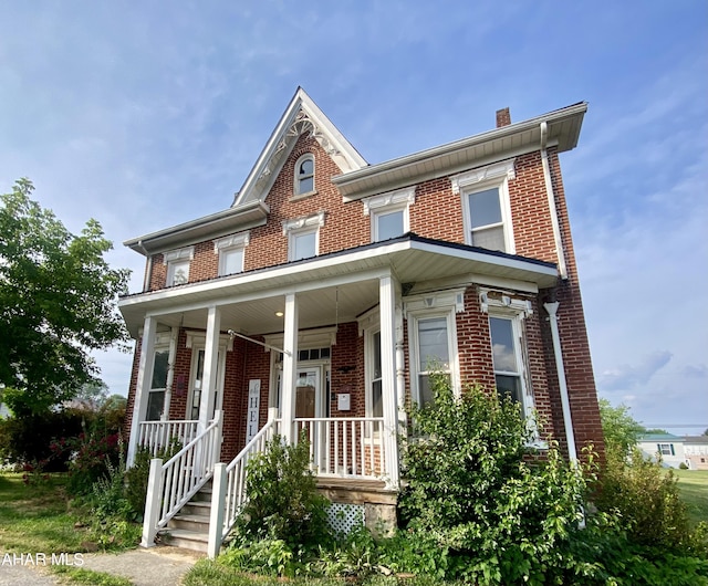 multi unit property featuring a porch