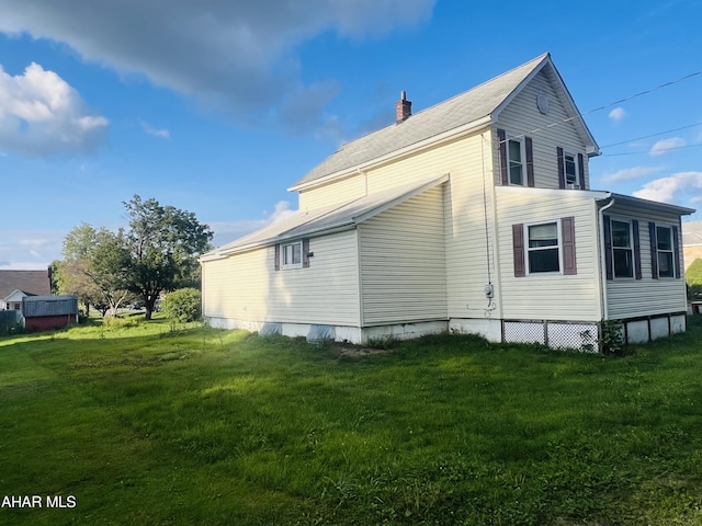 view of home's exterior featuring a yard