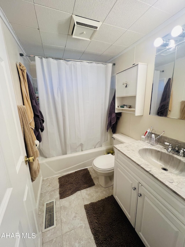 full bathroom with tile patterned floors, vanity, shower / bath combo, and toilet