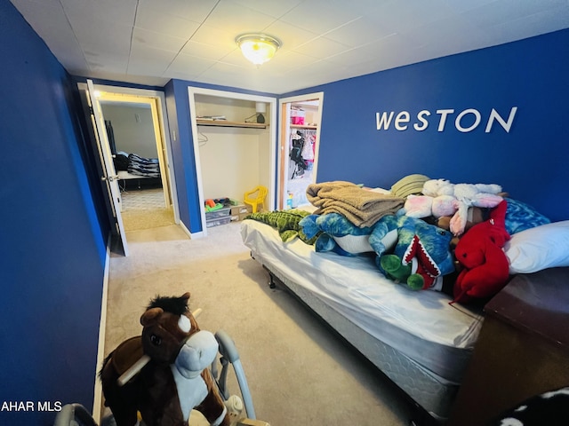 bedroom with carpet floors and a closet