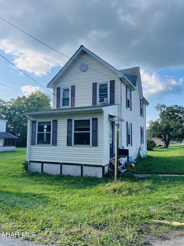 view of front of home with a front yard