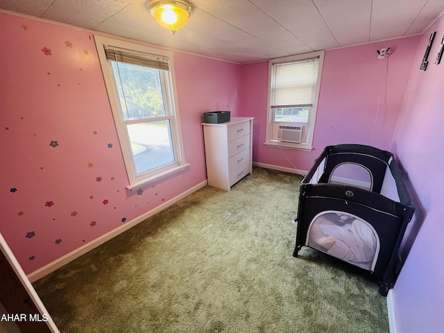 bedroom featuring carpet floors and cooling unit