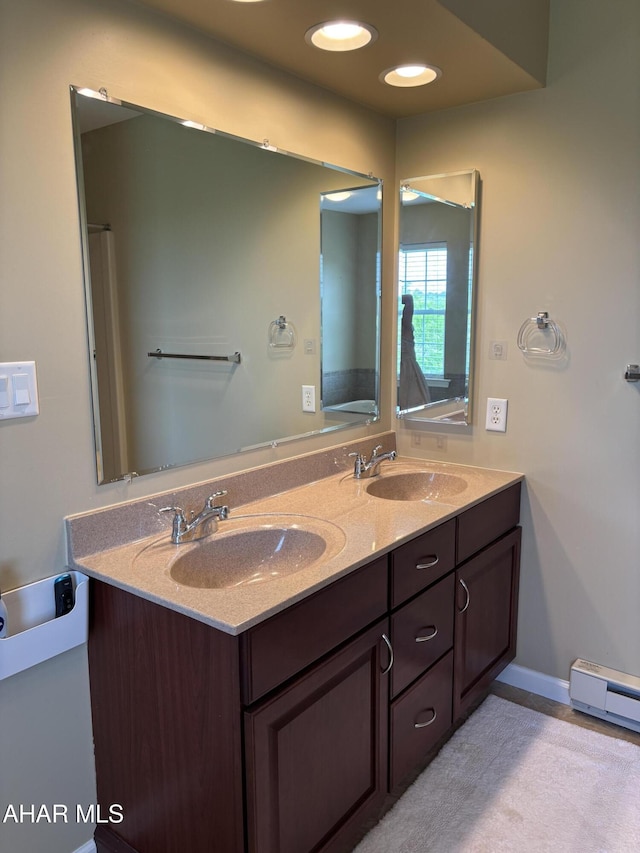215 Red Fox Dr, Duncansville, PA 16635 - bathroom featuring double vanity, a baseboard radiator, and a baseboard heating unit