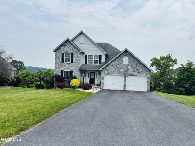 215 Red Fox Dr, Duncansville, PA 16635 - view of front facade with stone siding, asphalt driveway, a front lawn, and a garage