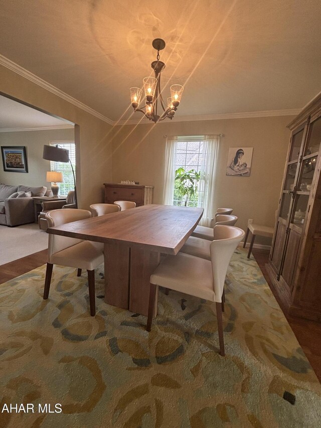 215 Red Fox Dr, Duncansville, PA 16635 - dining room with healthy amount of natural light, ornamental molding, a chandelier, and wood finished floors