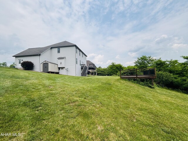 215 Red Fox Dr, Duncansville, PA 16635 - view of grassy yard with a deck and stairway