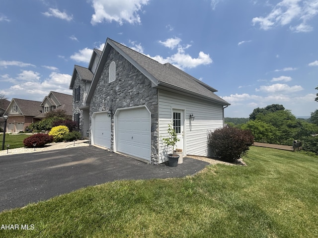 215 Red Fox Dr, Duncansville, PA 16635 - view of side of property featuring stone siding, asphalt driveway, a lawn, and roof with shingles