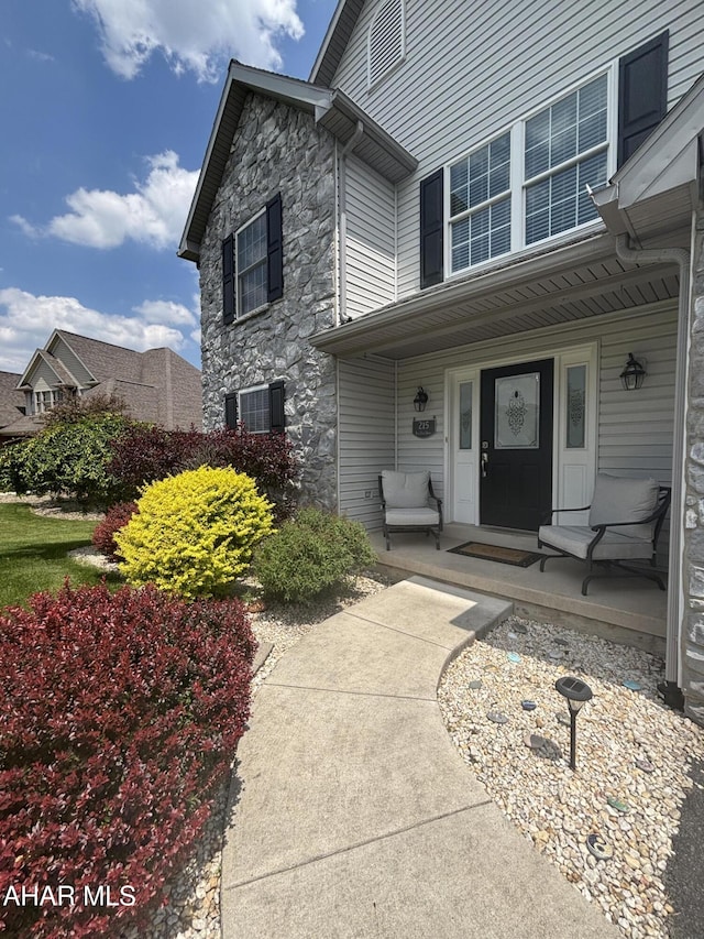 215 Red Fox Dr, Duncansville, PA 16635 - property entrance with stone siding and a porch