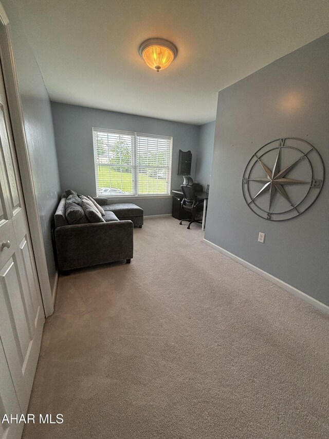 215 Red Fox Dr, Duncansville, PA 16635 - carpeted living room with an office area and baseboards