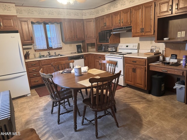 kitchen featuring white appliances and sink