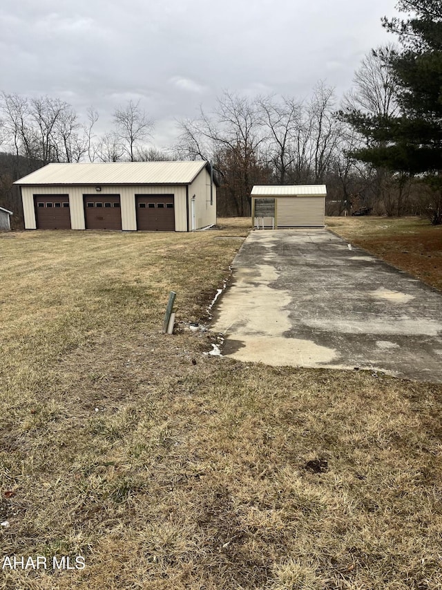 exterior space with a garage and an outdoor structure