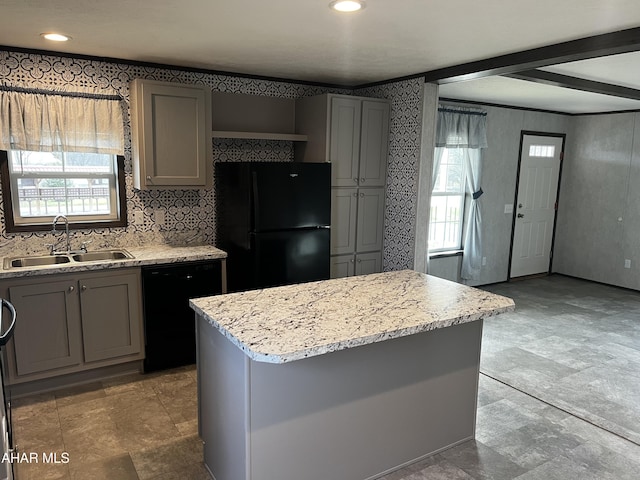 kitchen with backsplash, gray cabinetry, sink, black appliances, and a center island