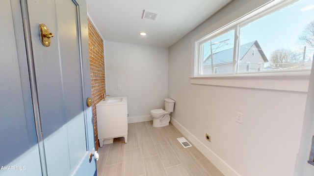 bathroom with toilet and sink