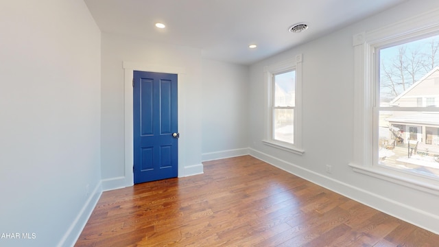 spare room featuring dark hardwood / wood-style flooring