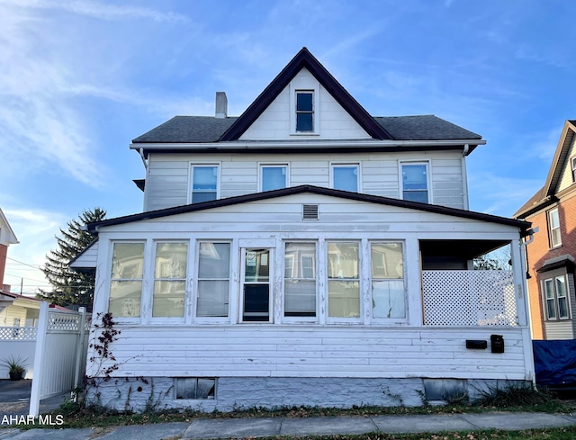 view of front of home with a sunroom