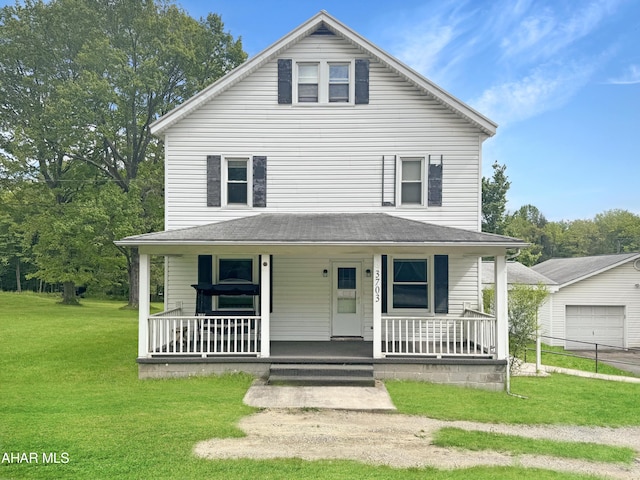 view of front facade with a front lawn and covered porch