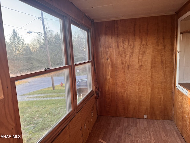 unfurnished sunroom with plenty of natural light