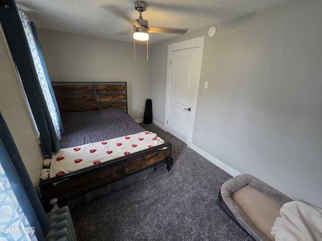 bedroom featuring ceiling fan, baseboards, and carpet floors