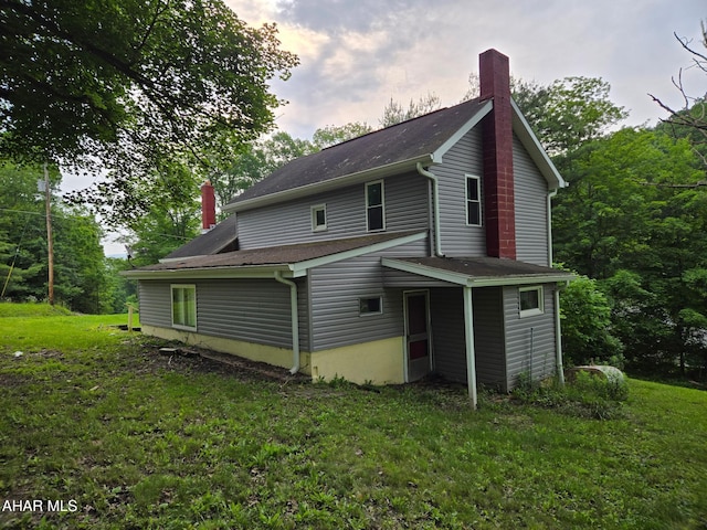 225 Mickel Ln, Duncansville, PA 16635 - rear view of property with a chimney and a lawn