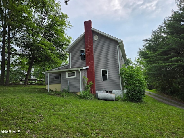 225 Mickel Ln, Duncansville, PA 16635 - back of property with a chimney and a yard