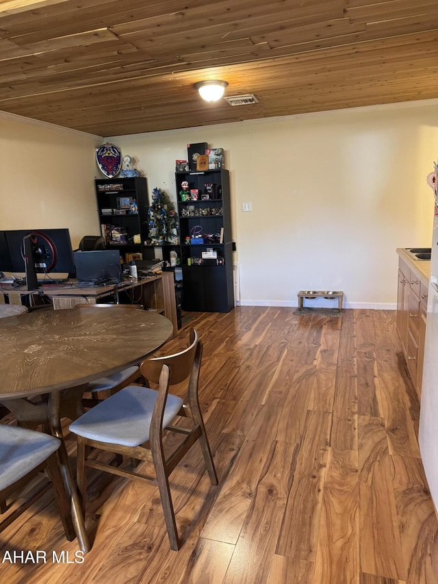 office area with wooden ceiling, baseboards, and wood finished floors