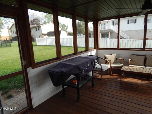 sunroom with an outdoor living space