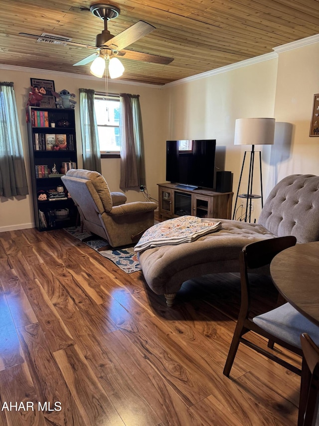 living room with ornamental molding, wood finished floors, baseboards, ceiling fan, and wood ceiling