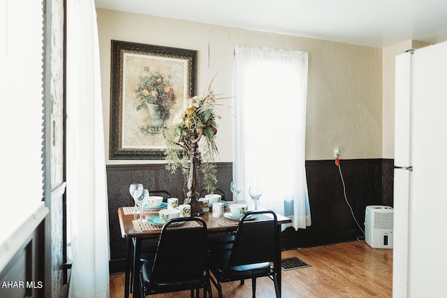 dining room with hardwood / wood-style flooring