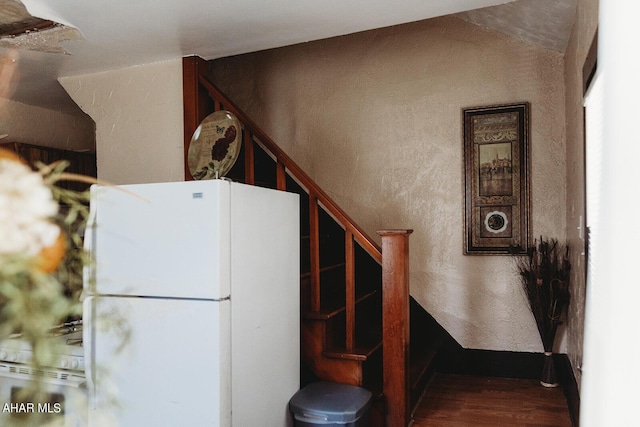 staircase featuring hardwood / wood-style flooring