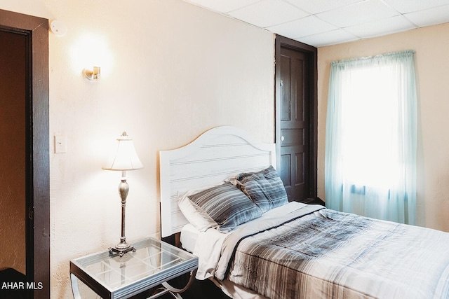 bedroom featuring a drop ceiling