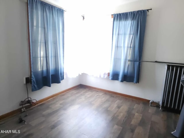 4924 Colonel Drake Hwy, Ashville, PA 16613 - spare room featuring radiator heating unit, baseboards, and wood finished floors