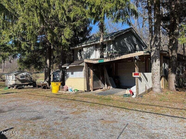 4924 Colonel Drake Hwy, Ashville, PA 16613 - view of front of home featuring a garage and dirt driveway