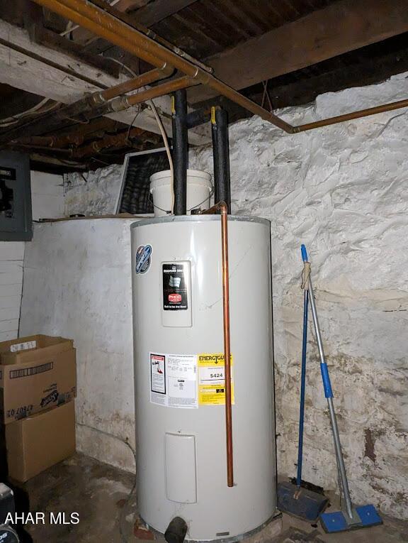 utility room featuring water heater