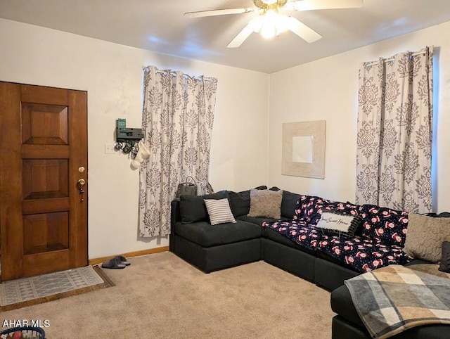 living room featuring ceiling fan and carpet