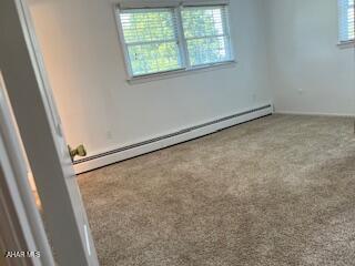 1012 Gray Ln, Duncansville, PA 16635 - empty room featuring baseboard heating, plenty of natural light, and carpet floors