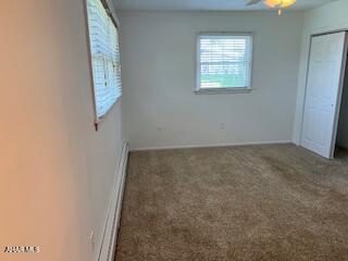 1012 Gray Ln, Duncansville, PA 16635 - unfurnished bedroom featuring carpet flooring, a baseboard radiator, and a closet