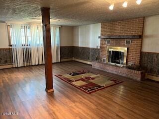 1012 Gray Ln, Duncansville, PA 16635 - unfurnished living room featuring wainscoting, a fireplace, and wood finished floors