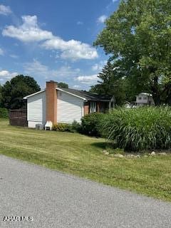 1012 Gray Ln, Duncansville, PA 16635 - view of side of property featuring a yard and a garage
