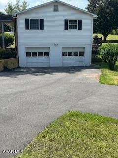 1012 Gray Ln, Duncansville, PA 16635 - view of side of property featuring a garage and asphalt driveway