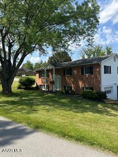 1012 Gray Ln, Duncansville, PA 16635 - split foyer home featuring an attached garage and a front lawn