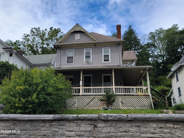 view of front of property featuring covered porch