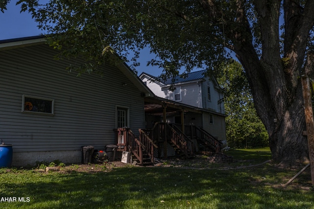 back of house with a yard