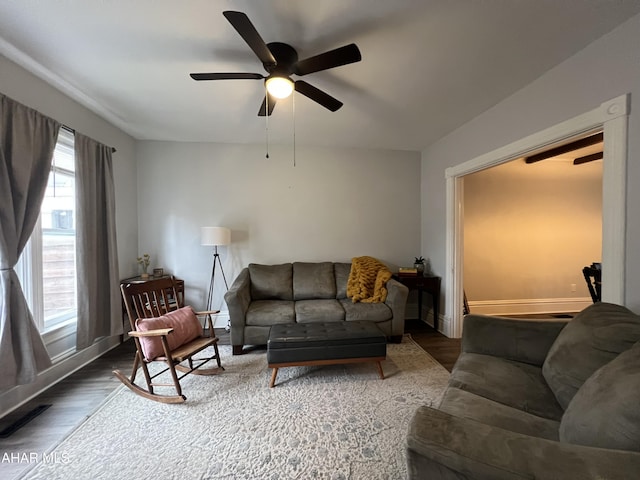 living room with ceiling fan and hardwood / wood-style flooring