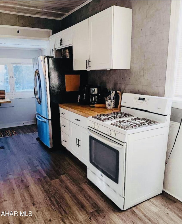 kitchen featuring white cabinets, dark wood-type flooring, butcher block countertops, and gas range gas stove