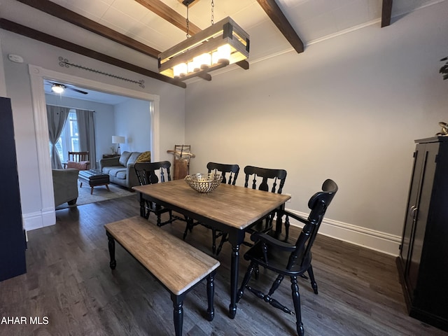 dining space with beam ceiling and dark hardwood / wood-style flooring