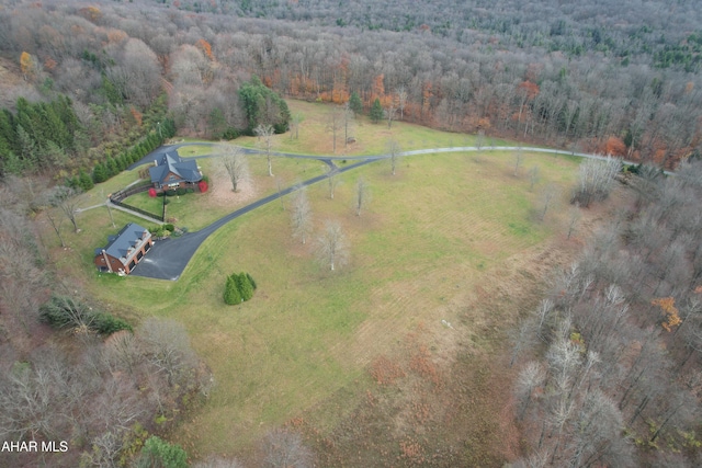 birds eye view of property with a rural view